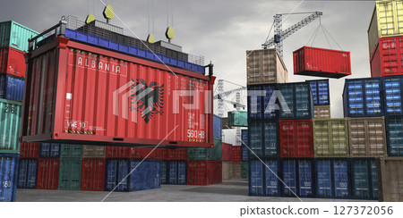 Cargo container with flag of Albania lifted by crane at freight terminal - 3D illustration 127372056