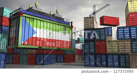 Cargo container with flag of Equatorial Guinea lifted by crane at freight terminal - 3D illustration 127372095