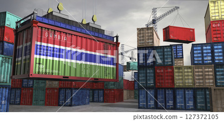 Cargo container with flag of Gambia lifted by crane at freight terminal - 3D illustration 127372105