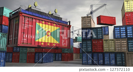 Cargo container with flag of Grenada lifted by crane at freight terminal - 3D illustration 127372110