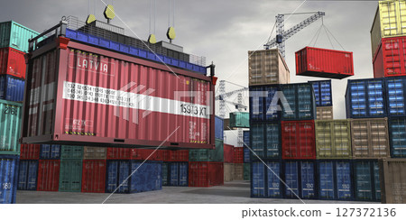 Cargo container with flag of Latvia lifted by crane at freight terminal - 3D illustration 127372136