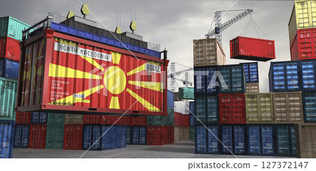 Cargo container with flag of North Macedonia lifted by crane at freight terminal - 3D illustration 127372147