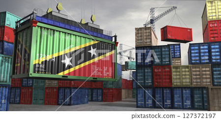 Cargo container with flag of Saint Kitts and Nevis lifted by crane at freight terminal - 3D illustration 127372197