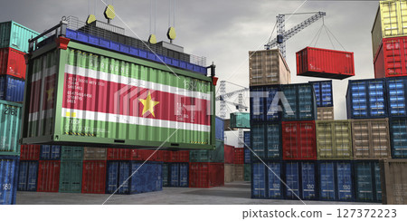 Cargo container with flag of Suriname lifted by crane at freight terminal - 3D illustration 127372223