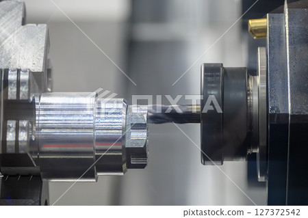 The CNC lathe machine milling process on metal shaft parts by flat nose end mill tool. The CNC lathe machine milling process on metal shaft parts by flat nose end mill tool. 127372542