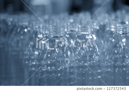 The group of drinking water bottles in the light blue scene. The group of drinking water bottles in the light blue scene. 127372543