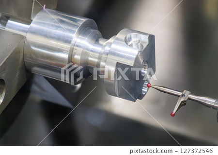The modular touch probe checking the aluminum shaft parts on CNC lathe machine. 127372546