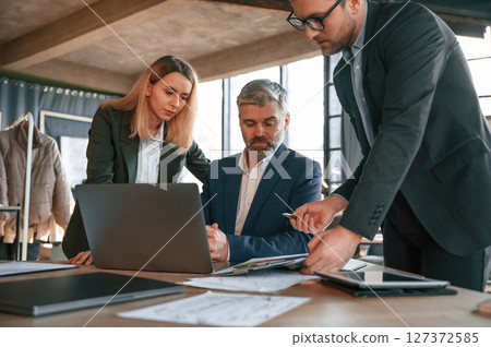 Cooperative business. Group of people are working in the modern office 127372585