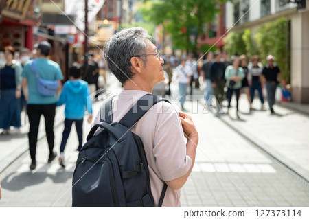 senior man walking in the city senior man walking in the city 127373114
