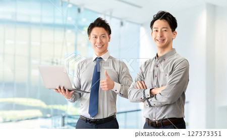 Teamwork image of two male businessmen Teamwork image of two male businessmen 127373351