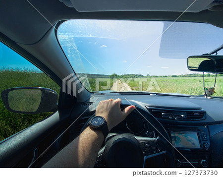 Driving on a Scenic Rural Dirt Road 127373730