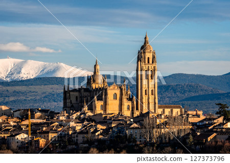 Breathtaking view of Segovia cathedral and cityscape with Guadarrama mountains. Breathtaking view of Segovia cathedral and cityscape with Guadarrama mountains. 127373796