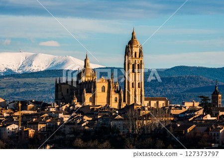 Breathtaking view of Segovia cathedral and cityscape with Guadarrama mountains. Breathtaking view of Segovia cathedral and cityscape with Guadarrama mountains. 127373797