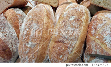 Different Types of Freshly Baked Bread Loaves Arranged Together for Display in a Bakery 127374323