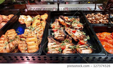 Grilled Steaks and Seasoned Meats Available for Sale at Local Market Grilled Steaks and Seasoned Meats Available for Sale at Local Market 127374326