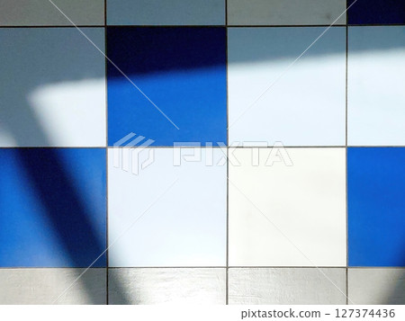 Colored Tiles Creating Patterns on the Floor With Fascinating Shadows in Natural Light 127374436