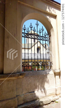 Charming View of the Armenian Cathedral Courtyard in Lviv With Wrought Iron Gate Charming View of the Armenian Cathedral Courtyard in Lviv With Wrought Iron Gate 127374491