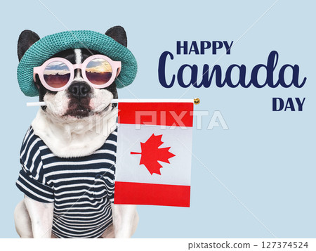 Happy Canada Day. Cute puppy and Canadian Flag. Happy Canada Day. Cute puppy and Canadian Flag. 127374524