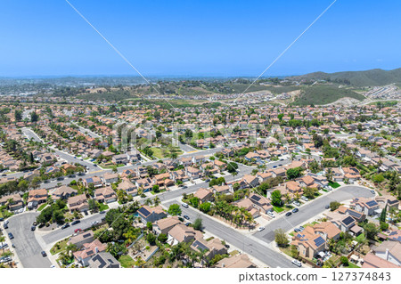 Aerial view of San Marcos neighborhood, with houses and street. South California 127374843