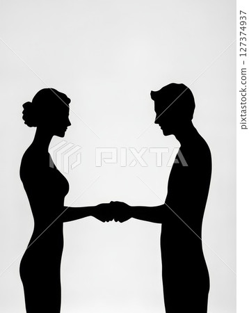 Silhouettes of man and woman shaking hands against a soft gradient background with copy space Silhouettes of man and woman shaking hands against a soft gradient background with copy space 127374937