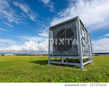 Modern carbon capture facility reducing emissions in industrial area 127375230