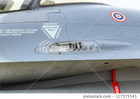 inset trailing vents of 20 mm M61 Vulcan cannon on General Dynamics F-16 Fighting Falcon aircraft. 127375343