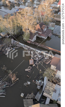 Floods on the planet, global warming. Climate change,natural disastersthe riot of nature. The apocalypse, catastrophes.Storms and destruction.The remnants of human life are floating in dirty water.End 127375514