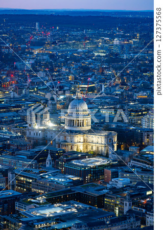 Aerial view captures St Paul's Cathedral illuminated at dusk. Aerial view captures St Paul's Cathedral illuminated at dusk. 127375568