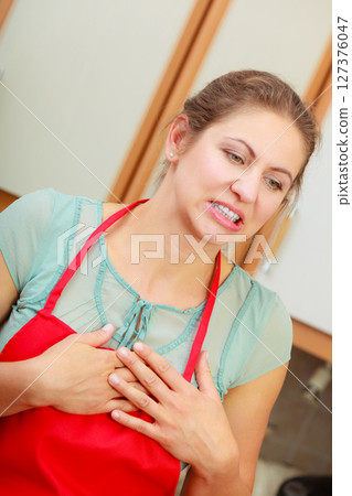Woman suffering from having heart attack. Woman suffering from having heart attack. 127376047