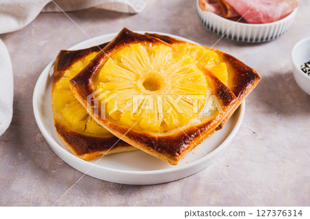 Sweet homemade pineapple tarts on a plate on the table Sweet homemade pineapple tarts on a plate on the table 127376314