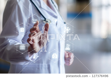 Health pro engaging with digital display. 127376496