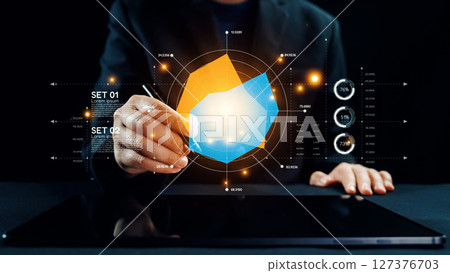Person Using Digital Tablet to Create 3D Graph Visualization with Futuristic Design Elements Displayed on Screen in Modern Workspace. Qubit Person Using Digital Tablet to Create 3D Graph Visualization with Futuristic Design Elements Displayed on Screen in Modern Workspace. Qubit 127376703