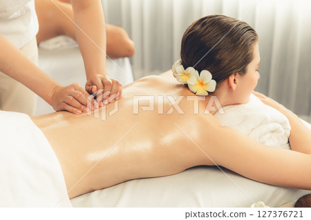 Caucasian couple customer enjoying relaxing anti-stress massage. Quiescent 127376721