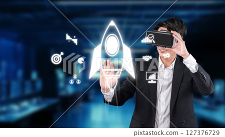 Businessman using virtual reality to strategize for startup growth and investment success in a dynamic and innovative environment XDMCP Businessman using virtual reality to strategize for startup growth and investment success in a dynamic and innovative environment XDMCP 127376729
