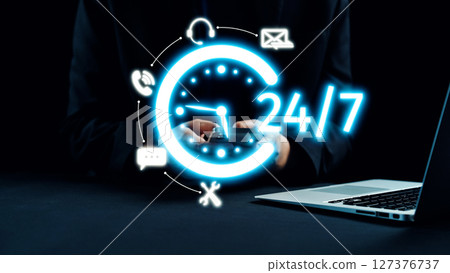 Concept of 24 hour Availability with Smartphone in Business Environment and Time Management Icons for Digital Communication in Modern Office. Qubit Concept of 24 hour Availability with Smartphone in Business Environment and Time Management Icons for Digital Communication in Modern Office. Qubit 127376737