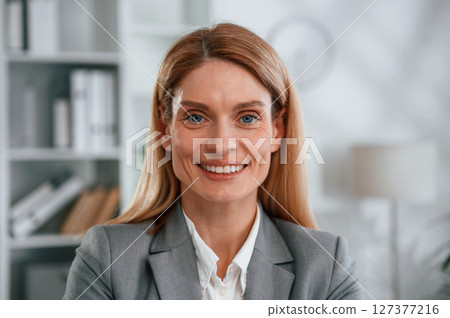 Portrait of woman in business formal clothes that is in the office 127377216
