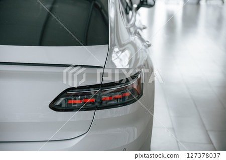 Close up view of the rear part of the modern white car Close up view of the rear part of the modern white car 127378037