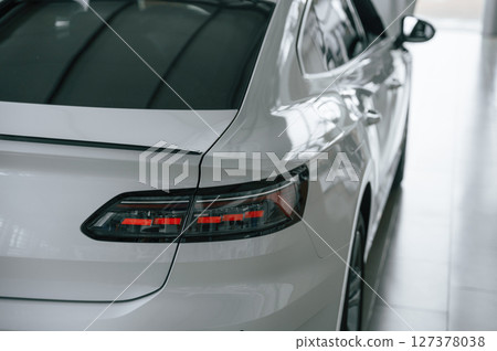 Close up view of the rear part of the modern white car Close up view of the rear part of the modern white car 127378038