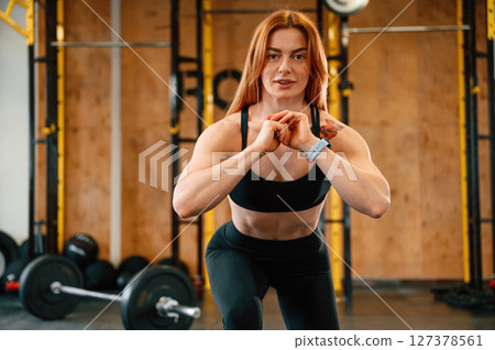 Warm up exercises. Beautiful strong woman is in the gym Warm up exercises. Beautiful strong woman is in the gym 127378561