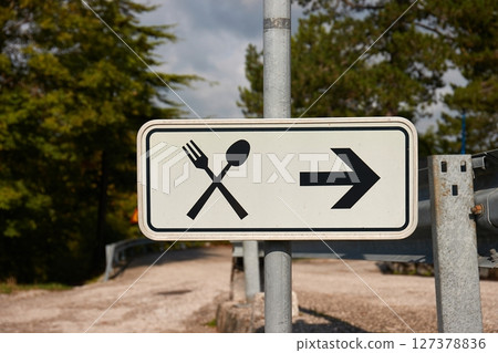 Restaurant sign by the road 127378836