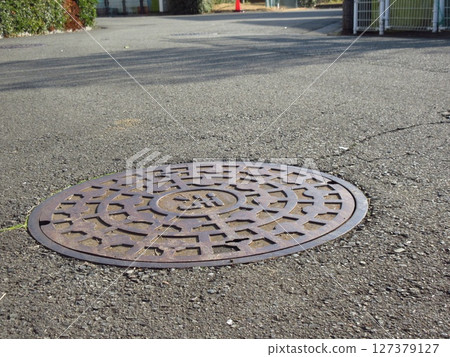 Manhole cover in Fuchu, Tokyo 127379127
