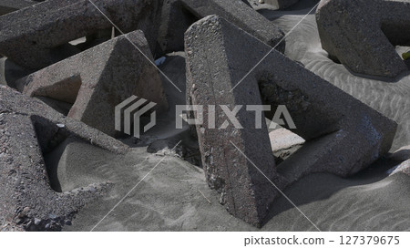 Triangular tetrapods installed on the beach 127379675