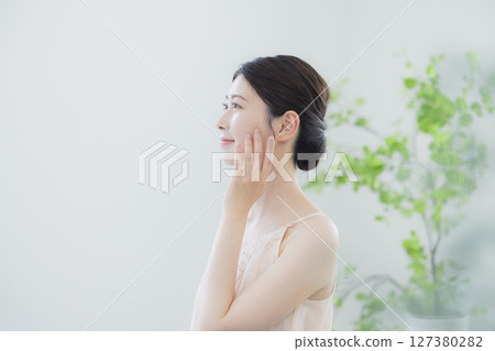 A young woman doing skin care A young woman doing skin care 127380282