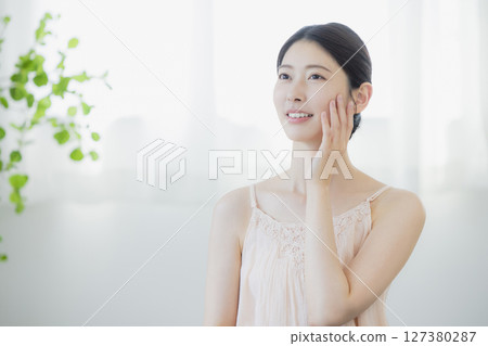 A young woman doing skin care 127380287