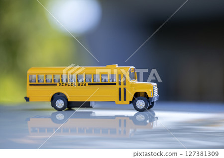 Toy american yellow school bus as symbol of education in the USA Toy american yellow school bus as symbol of education in the USA 127381309