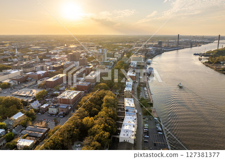 Savannah, Georgia. Old historic River Street architecture. View from above of illuminated streets at night. USA tourist attraction Savannah, Georgia. Old historic River Street architecture. View from above of illuminated streets at night. USA tourist attraction 127381377