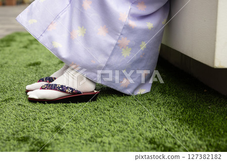 The feet of a woman wearing a kimono The feet of a woman wearing a kimono 127382182