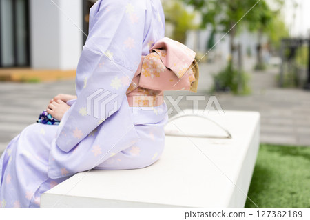 Close-up of a woman's obi wearing a kimono 127382189