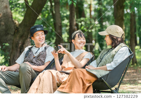 Parents and children/families chairing in parks and campsites Parents and children/families chairing in parks and campsites 127382229