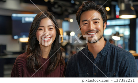 Smiling men and women standing side by side with a TV studio in the background Smiling men and women standing side by side with a TV studio in the background 127382251